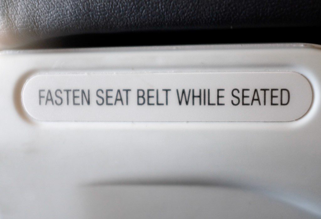 Fasten Seat Belt Sign on Plane Free Stock HD Photo