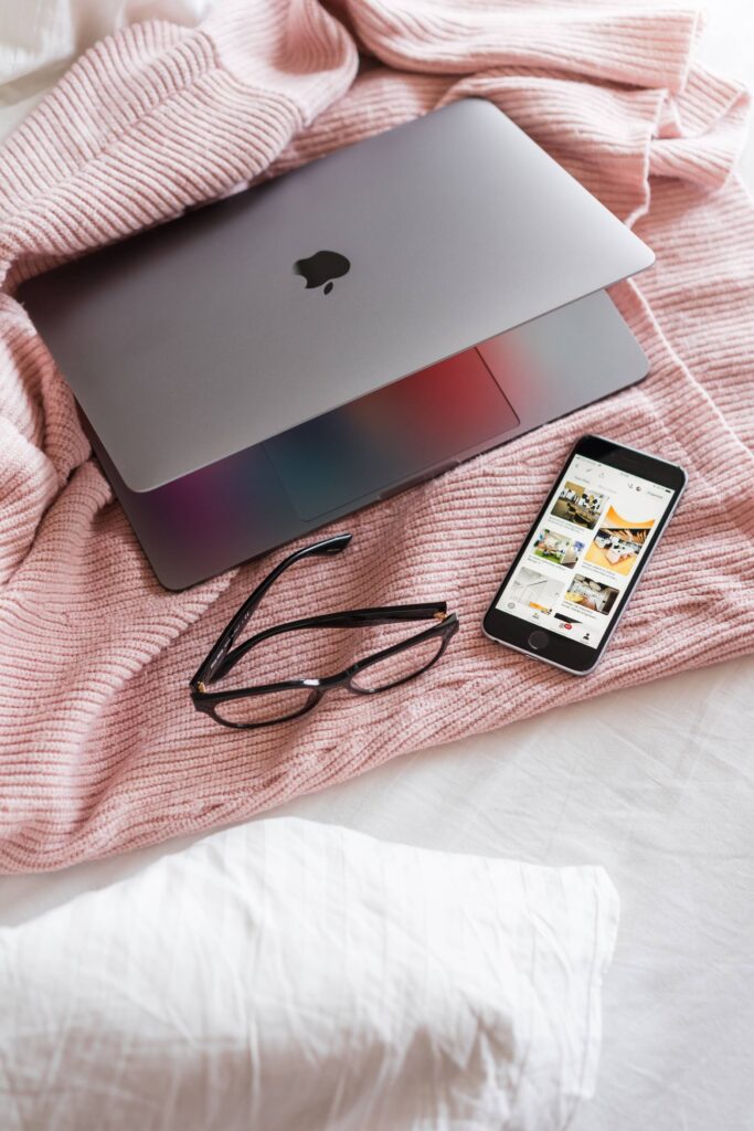 Feminine Ladypreneur Laptop and Smartphone on Bed Free Photo