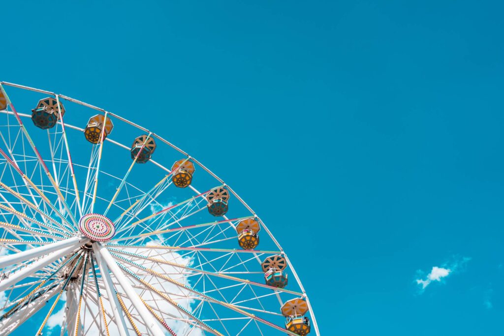 Ferris Wheel Amusement Park with Place for Text Free Photo