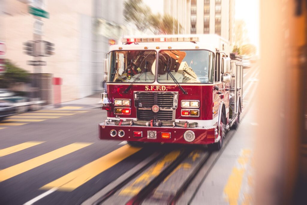 Fire Truck Racing Through The City Traffic Free Photo