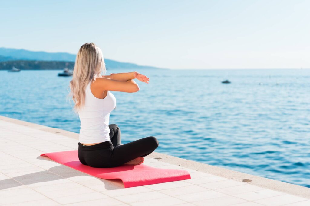 Fit Woman Stretching Her Body Before Her Morning Yoga Free Photo