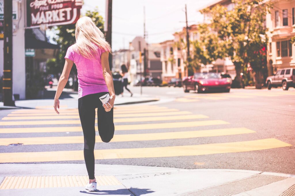 Fit Young Girl Stretching Her Legs Before Jogging Workout Free Photo