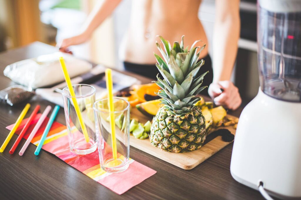 Fitness Girl Preparing Healthy Fruit Milkshake Free Photo