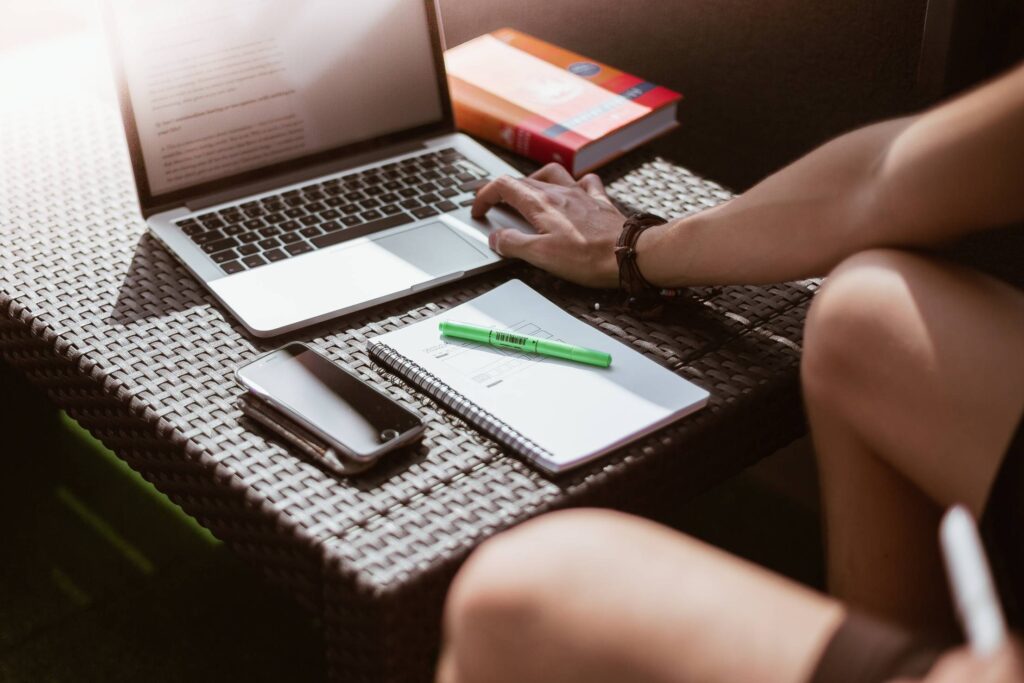 Freelance Designer Working on Laptop Outside on Terrace Free Photo