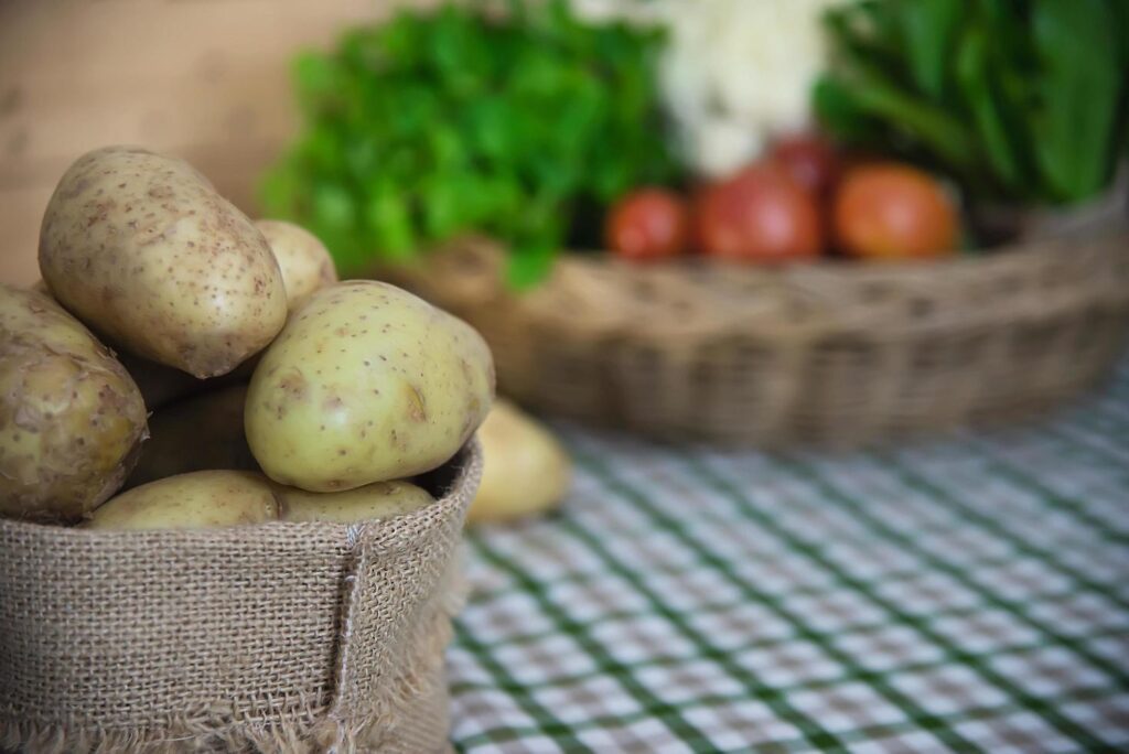 Fresh potato in kitchen ready to be cooked – fresh vegetable preparing for making food concept Stock Free