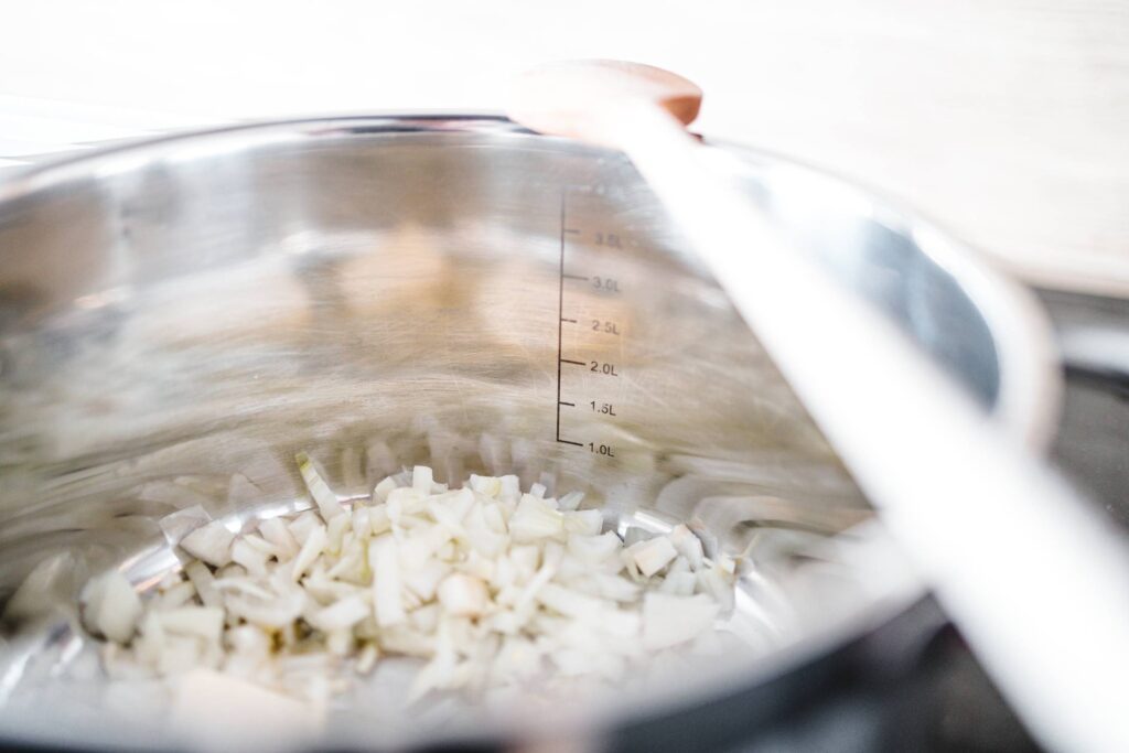 Fresh Sliced Onions in a Stainless Steel Cooking Pot Free Photo