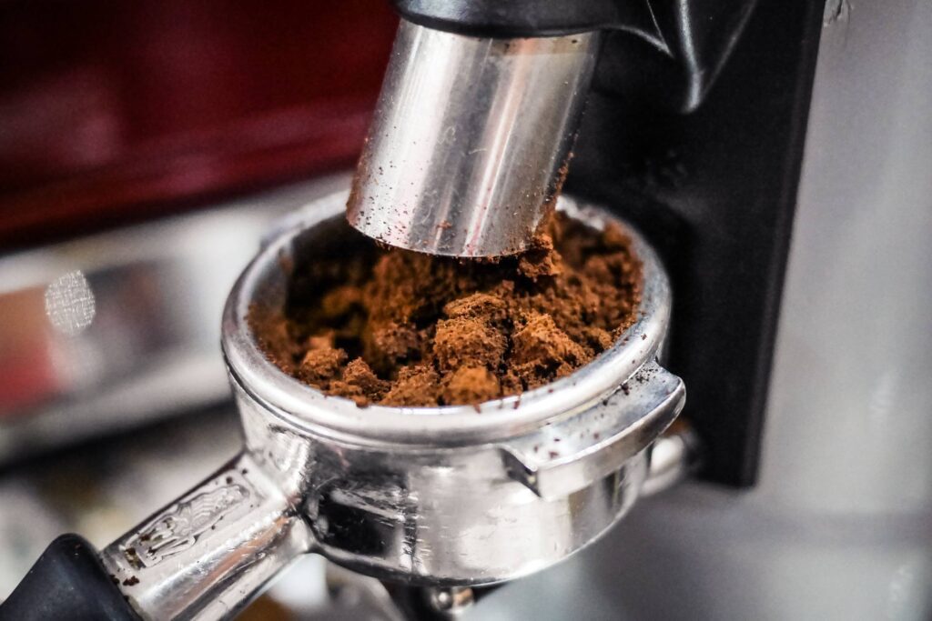 Freshly Ground Coffee from Coffee Grinder Free Photo