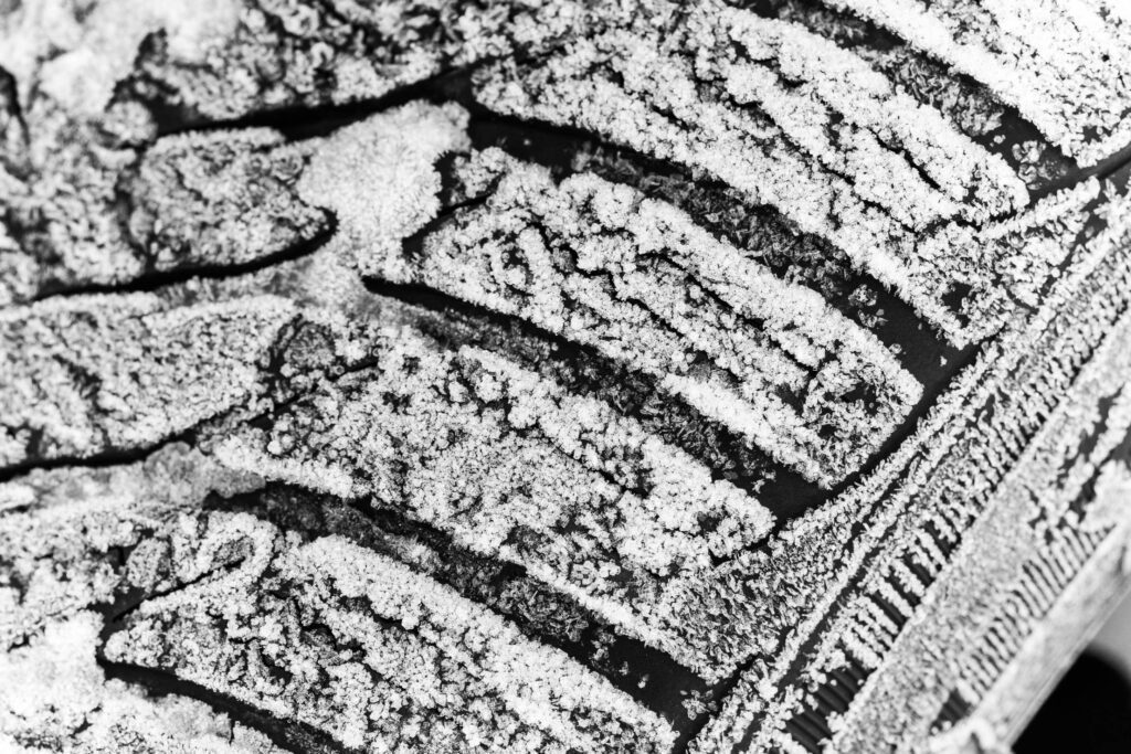 Frozen Winter Tire With Snow Close Up Free Photo