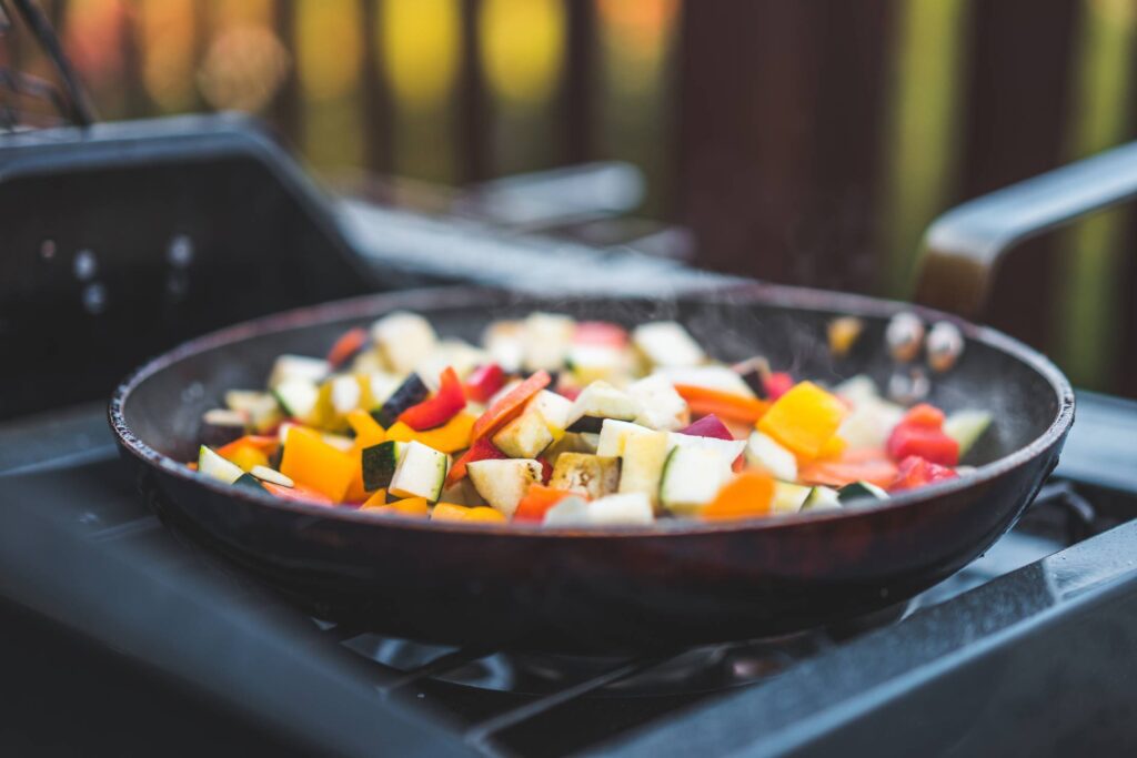 Frying Vegetables on a Pan Free Photo