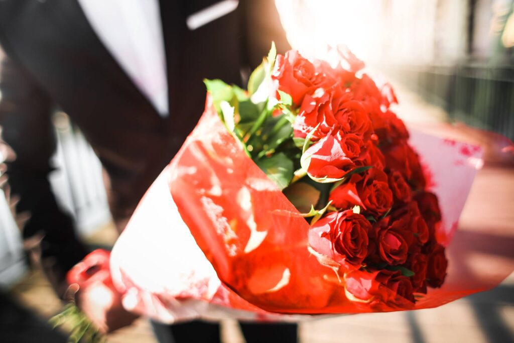 Gentleman Holding a Bouquet of Roses #2 Free Photo