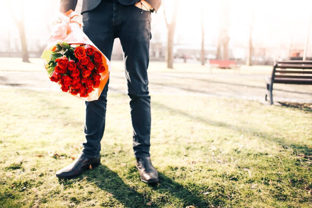 Gentleman Holding a Bouquet of Roses Free Photo