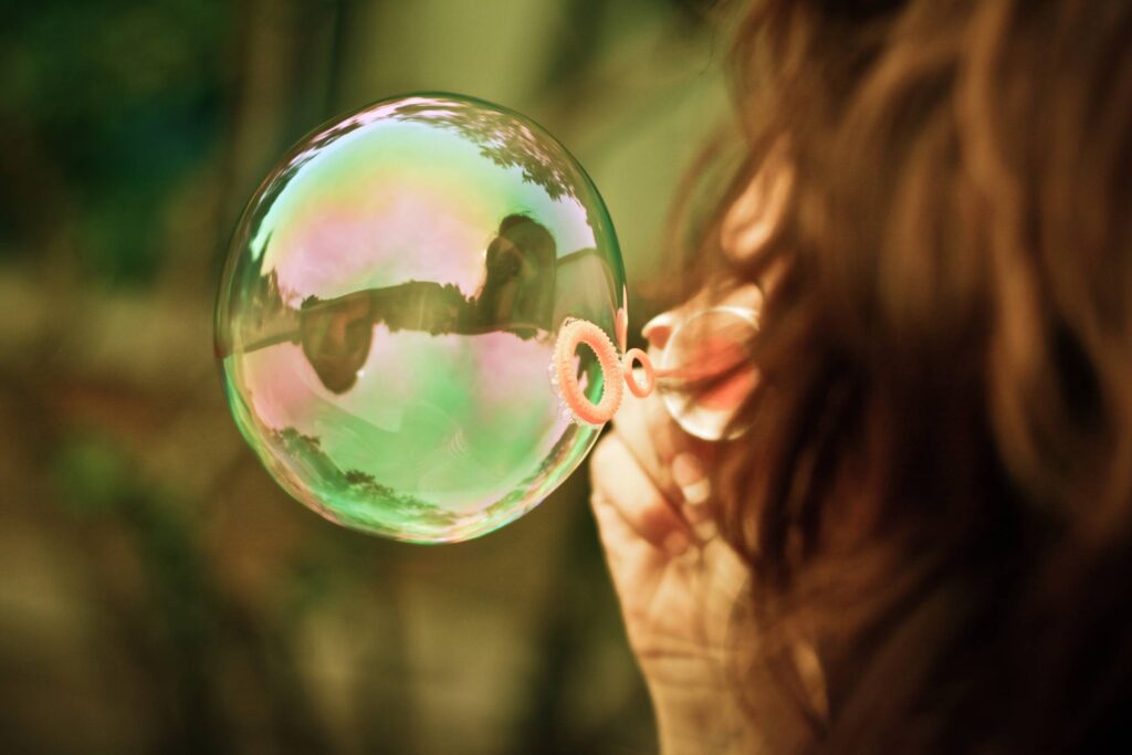 Girl Blowing a Bubble Free Photo