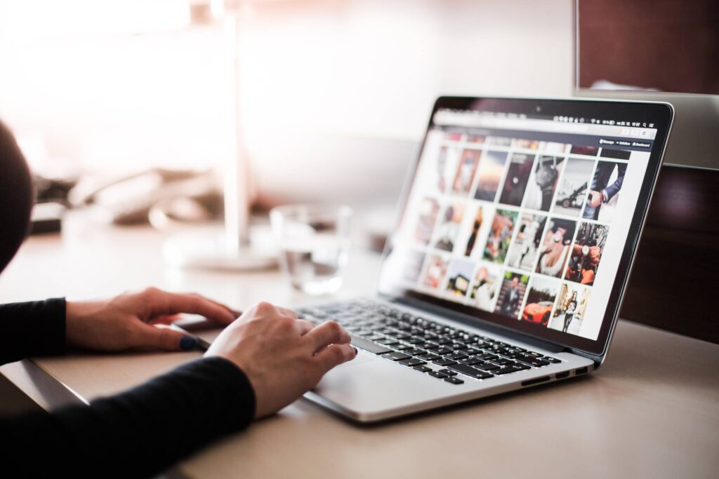 Girl Checking Tumblr on Her MacBook Pro Free Photo