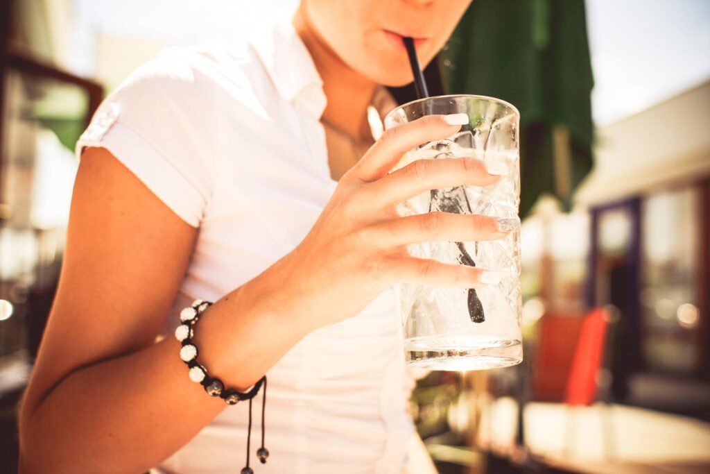 Girl Drinking Lemonade Cocktail Free Photo