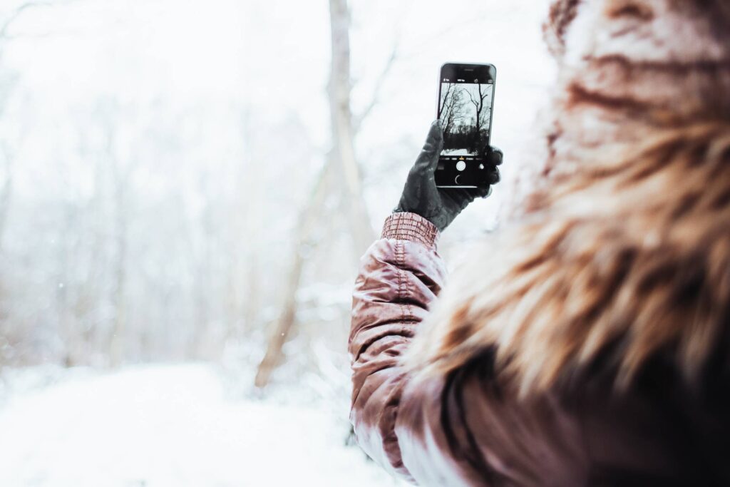 Girl Shooting with her iPhone 6 in Winter Free Photo