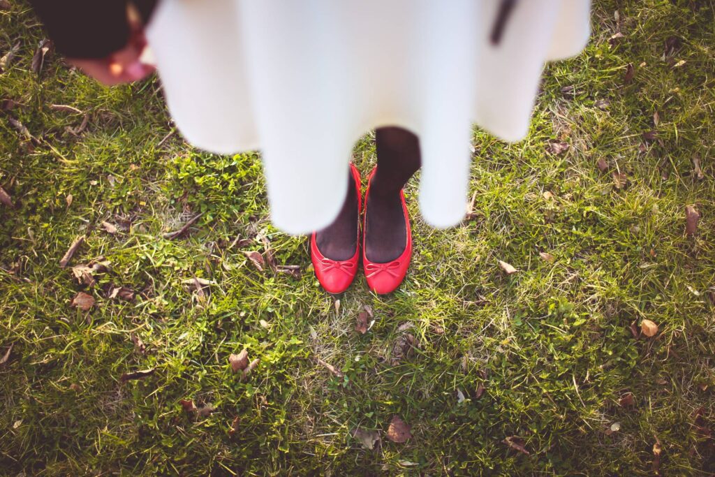 Girl Standing on the Autumn Grass Free Photo