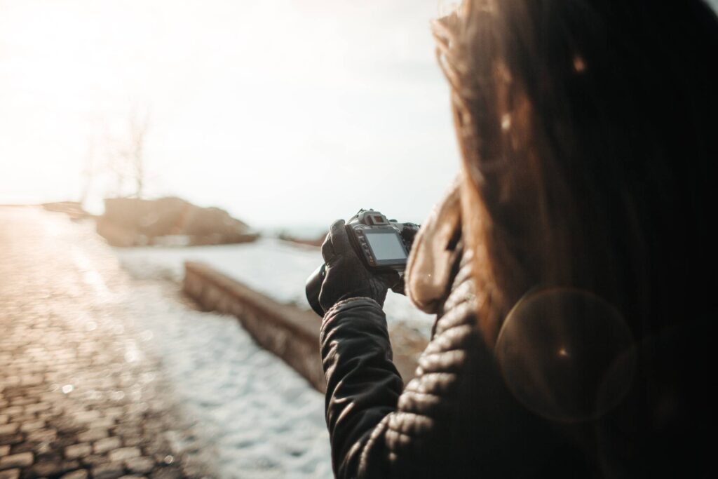 Girl Taking Photographs with her DSLR Free Photo