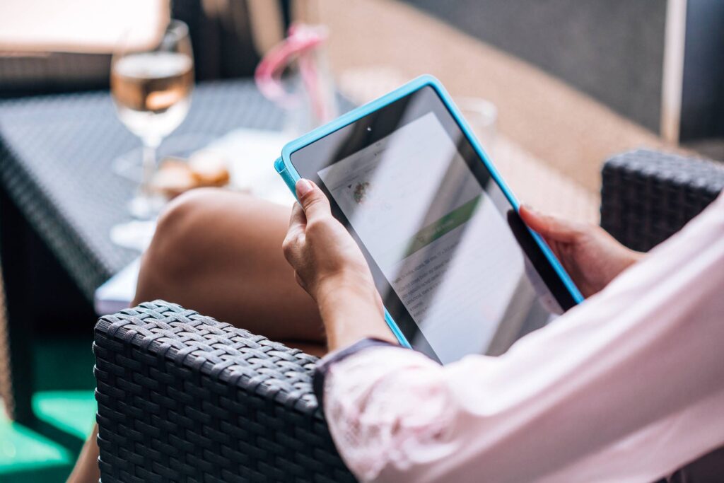 Girl using Tablet on the Garden Free Photo