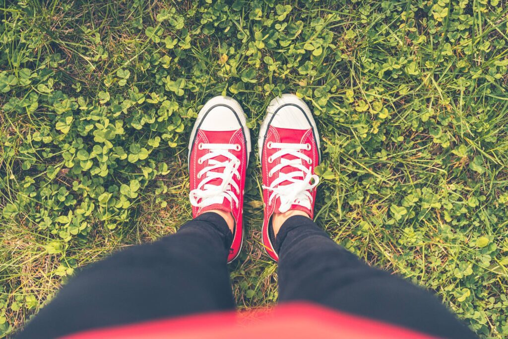 Girl with Red Shoes in Grass FPV Free Photo