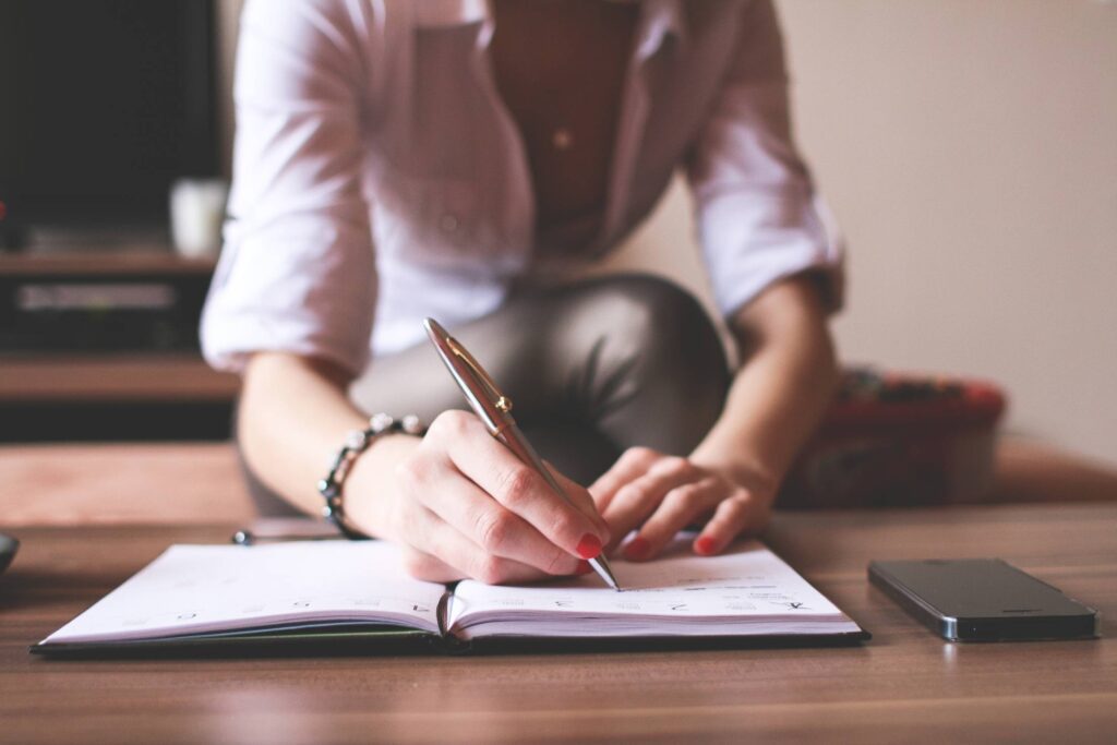 Girl Writing in a Diary Free Photo