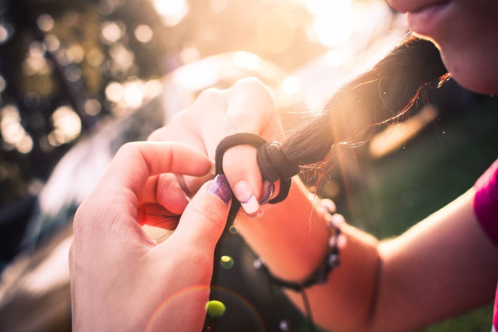 Girl’s Braid In Sunset Free Photo