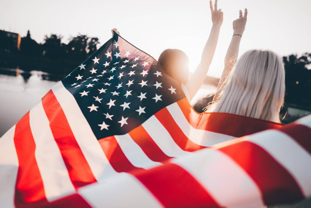 Girls Holding USA Flag Free Photo