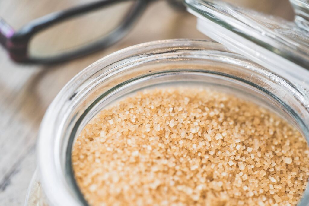 Glass Bowl with Brown Cane Sugar Close Up Free Photo