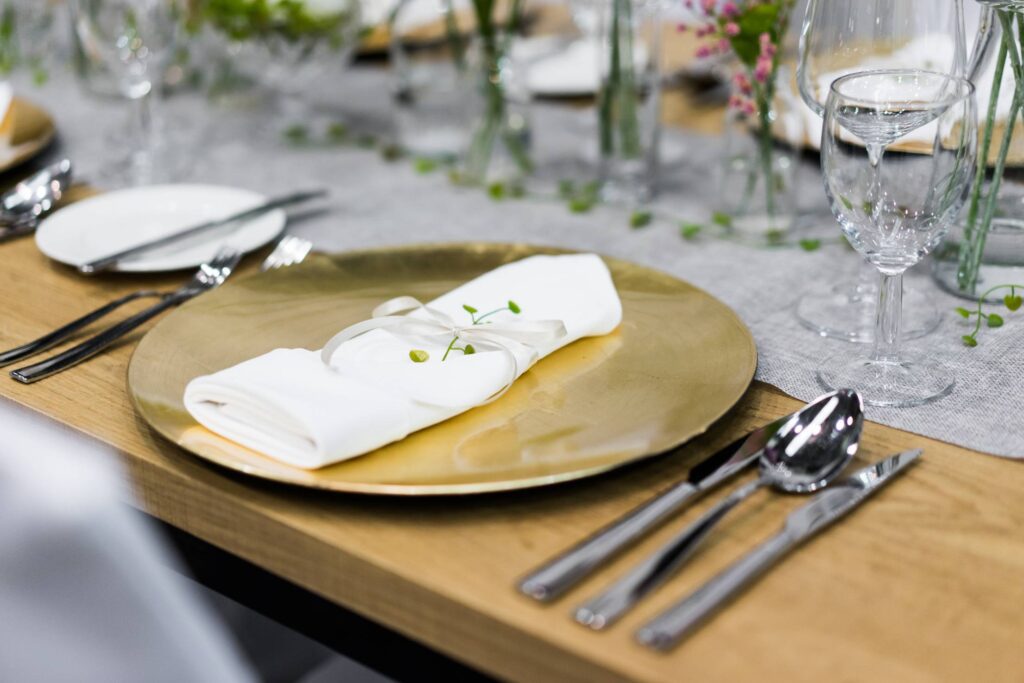 Gold Plates Wedding Table Settings and Decorations Close Up Free Photo