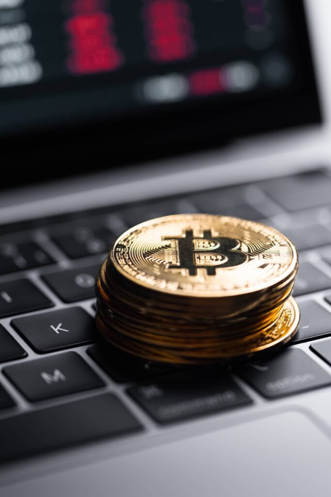 Golden Bitcoins on Laptop Free Photo