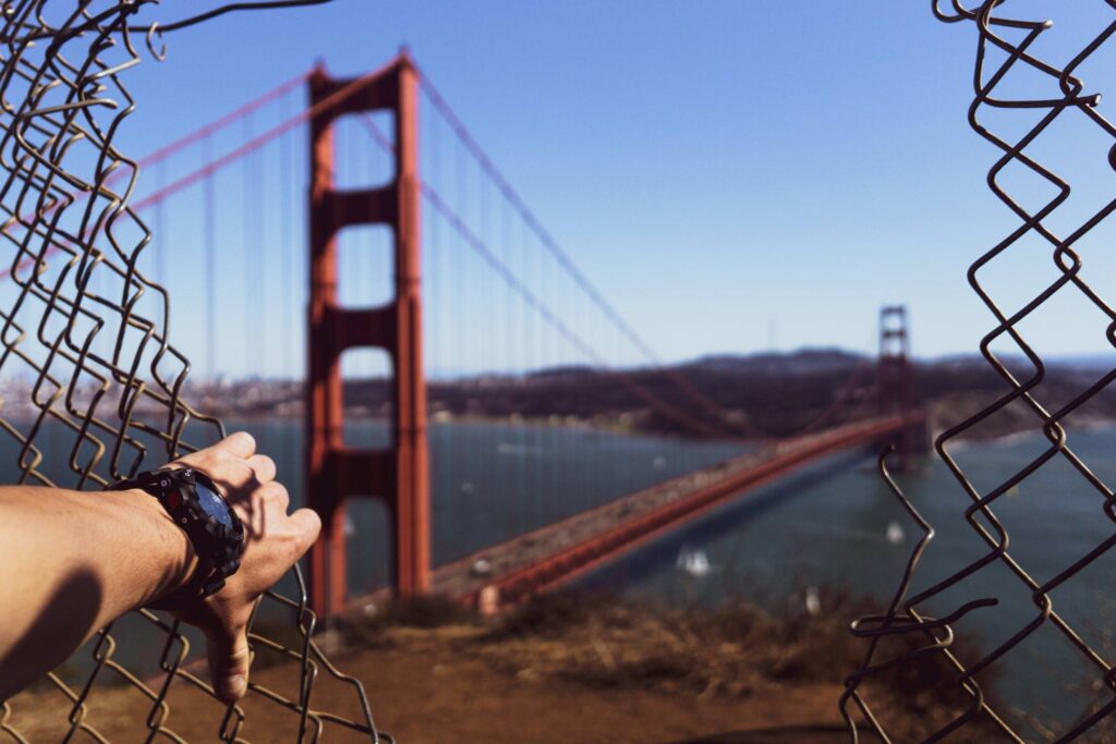 Golden Gate Bridge Through a Hole in a Fence Free Photo