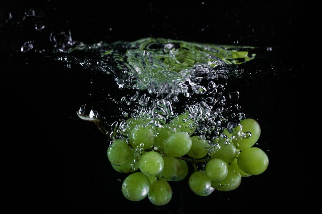 Grapes Thrown in Water Free Photo