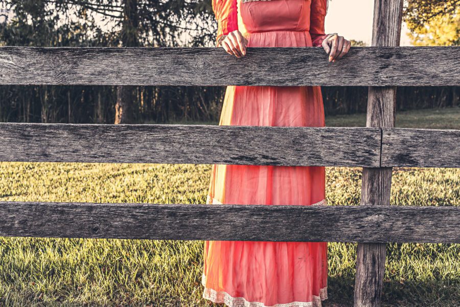 Red Dress & Wood Fence Free Stock Photo