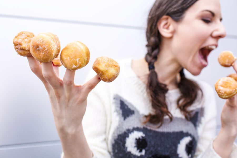 Woman with Donut Fingers Free Stock Photo