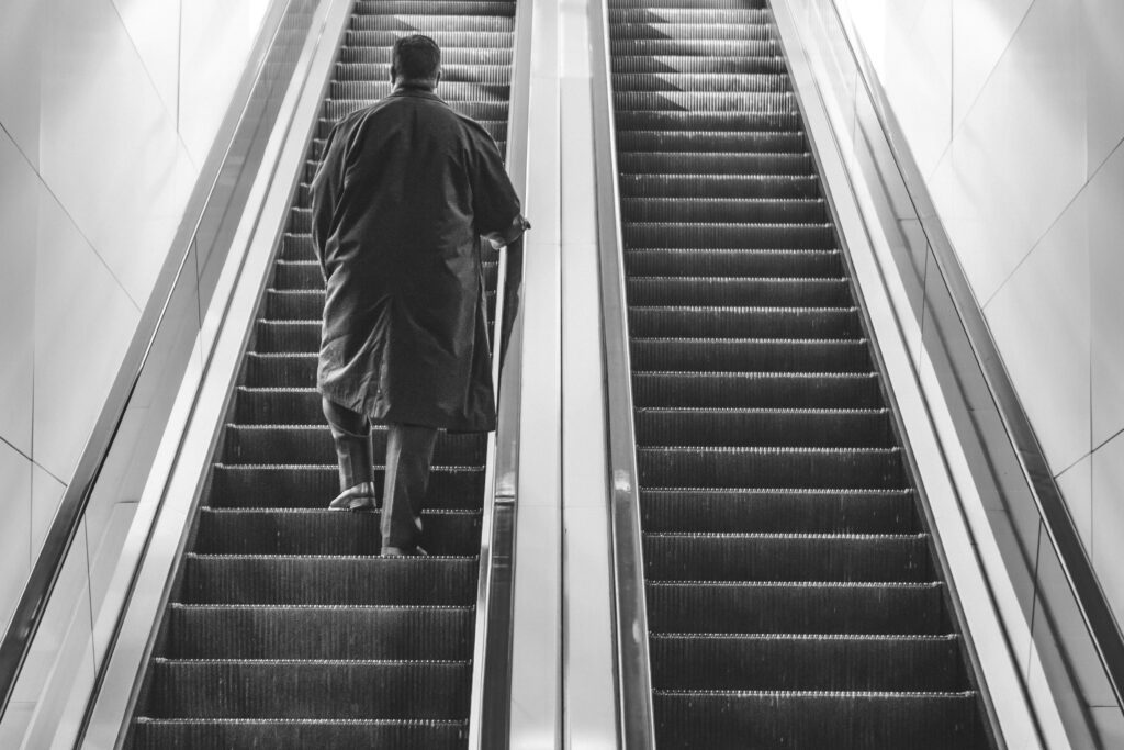 Walking Up Escalator Free Stock Photo