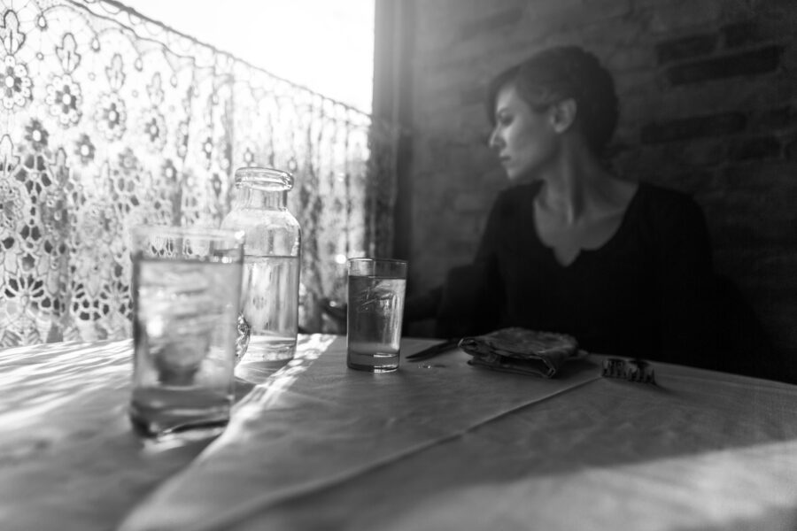 Lady in Restaurant Thinking Free Stock Photo