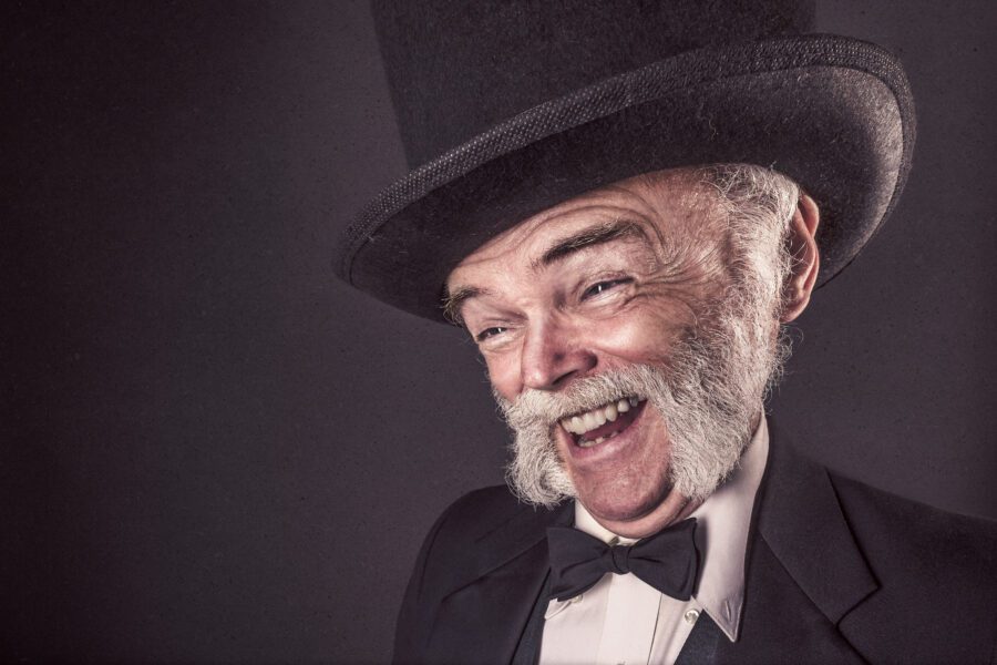 Smiling Man in Goofy Hat Free Stock Photo