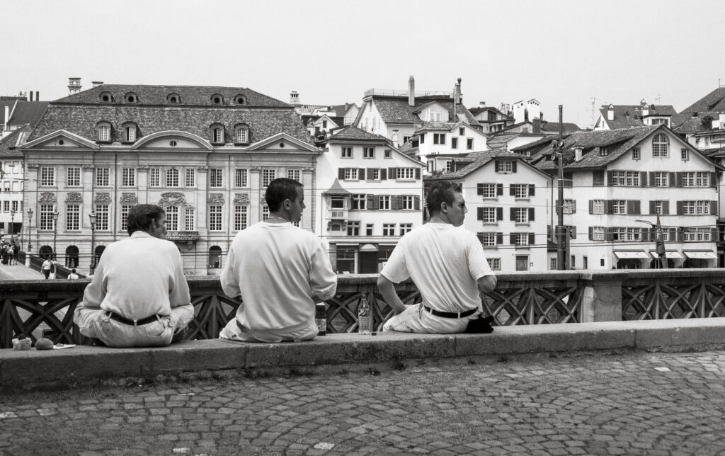 Boys Sitting on a Wall Free Stock Photo