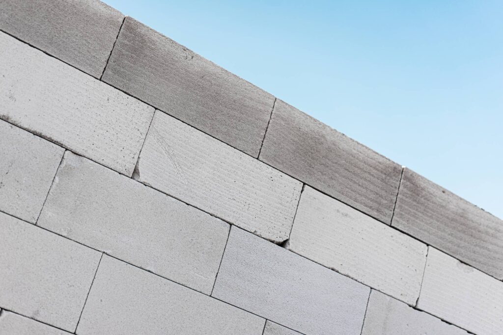 Grey Brick Wall with a Blue Sky Free Photo