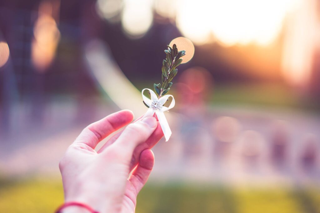 Groom Boutonniere in Hand Free Photo