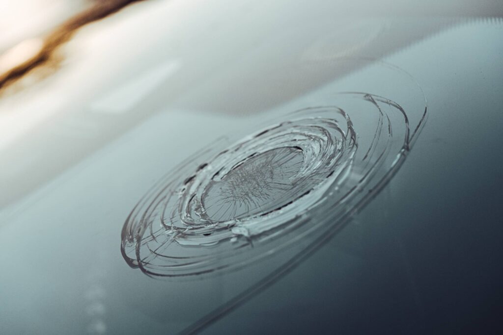 Hail Damaged Windshield of a Car Free Photo