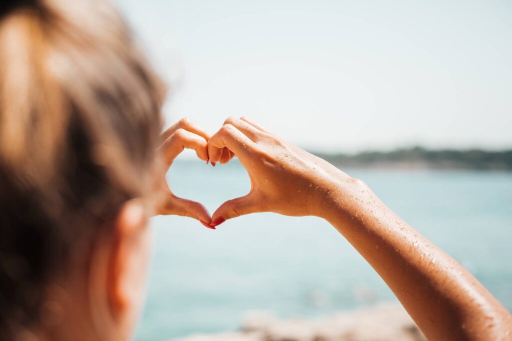 Hand Love Heart by the Sea Free Photo