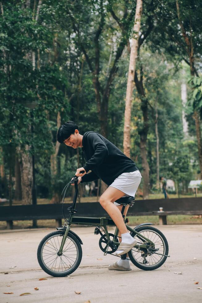 Handsome happy young man with bicycle on a city street, Active lifestyle, people concept Stock Free