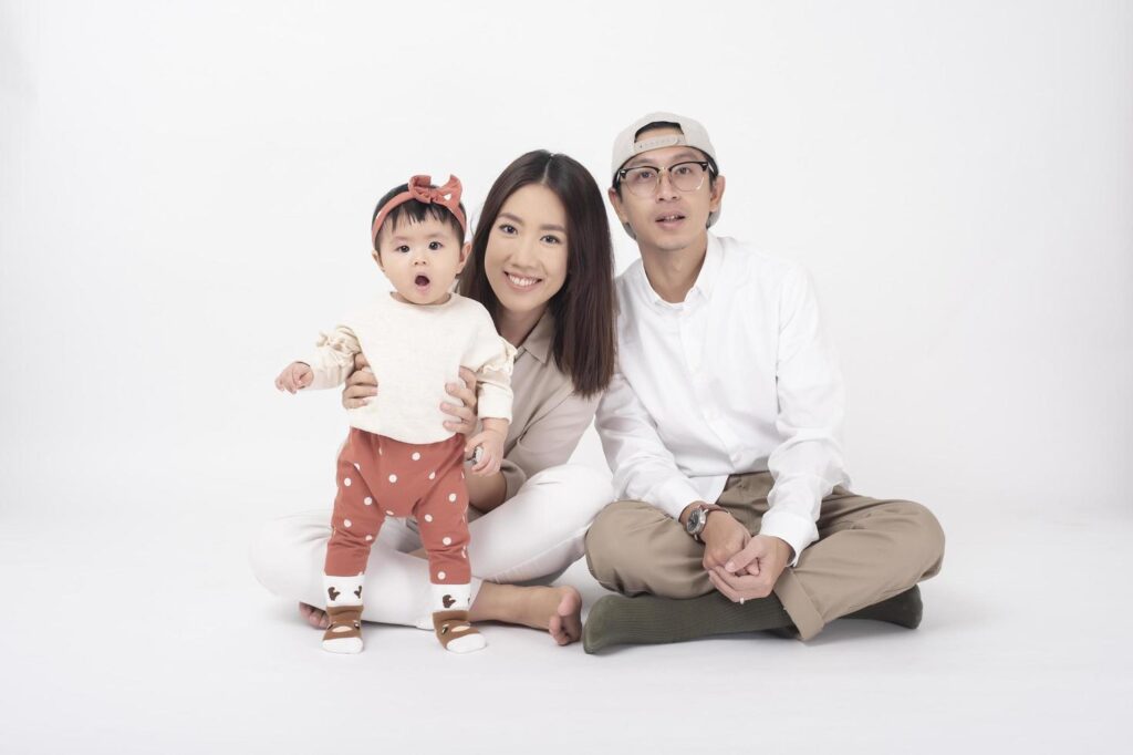 Happy Asian family on white background Stock Free