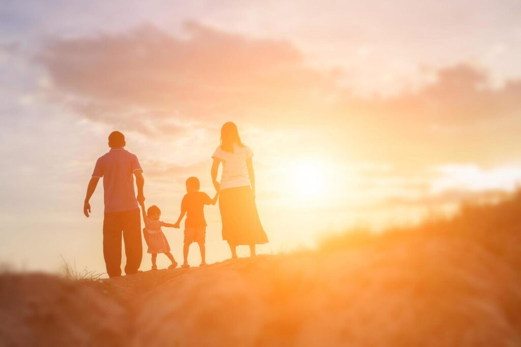 Happy family dancing on the road in the sunset time. Evening party on the nature Free Photo