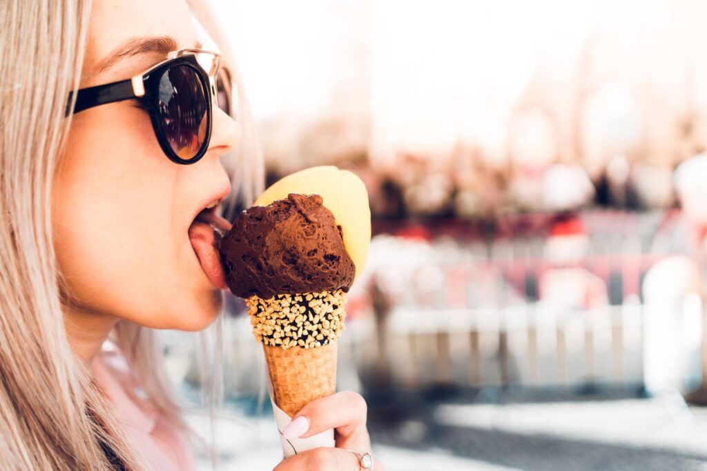 Happy Girl Licking Chocolate Ice Cream in Summer Free Photo