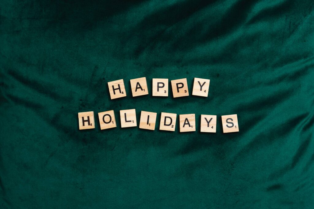 Happy Holidays on Green Velvet Background Free Photo