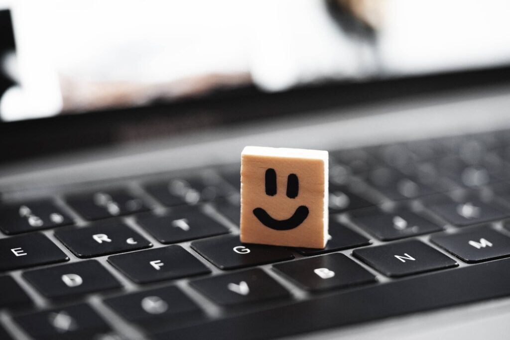 Happy Smiley on Laptop Keyboard Free Photo