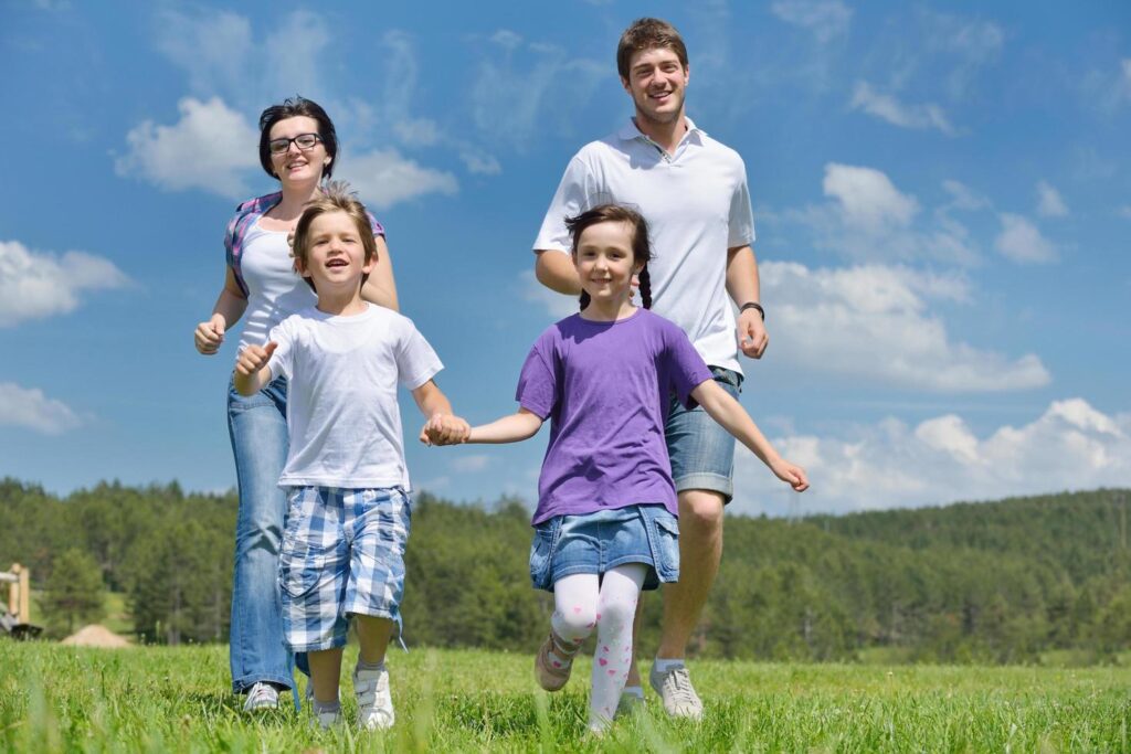 happy young family have fun outdoors Stock Free