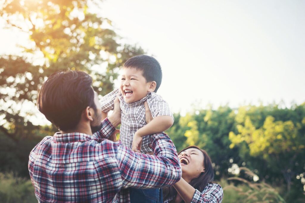 
									Happy young family spending time together outside. Family love concept Stock Free