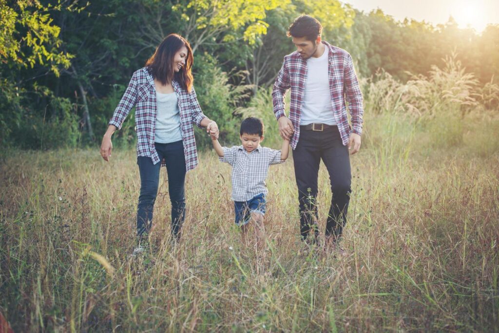 Happy young family spending time together outside. Family love concept Free Photo